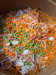A picture of Garnished jollof rice.