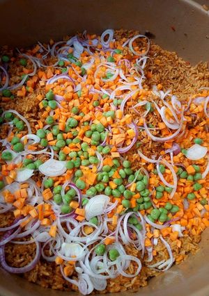 A picture of Garnished jollof rice.