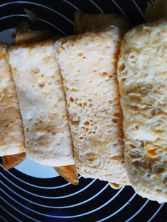 Una foto de Tortillas enrolladas de jamón y queso