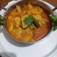 A picture of Lima beans curry with ghobi and aloo.