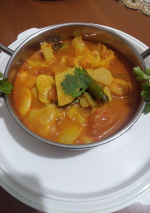 A picture of Lima beans curry with ghobi and aloo.