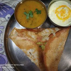 A picture of Crispy dosa with sweet corn filling.