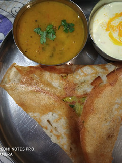 A picture of Crispy dosa with sweet corn filling.