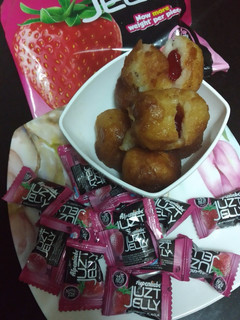 A picture of Jelly filled sweet bread roll.