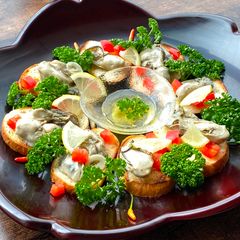A picture of Oyster pickled in Garlic Olive Oil.