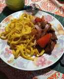 Lomo saltado con tallarines a la huancaína