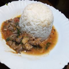 A picture of Rice and goat meat stew.
