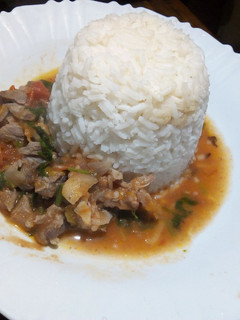 A picture of Rice and goat meat stew.