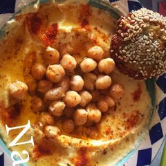 A picture of Falafel with hummus.