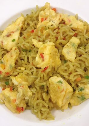 A picture of Noodles and fried omelette...Kiddies school lunch.