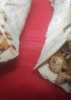 Una foto de Taquitos de cerdo y pollo