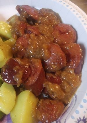 A picture of Saucisses Soubise /Sausage Cooked in onion sauce.