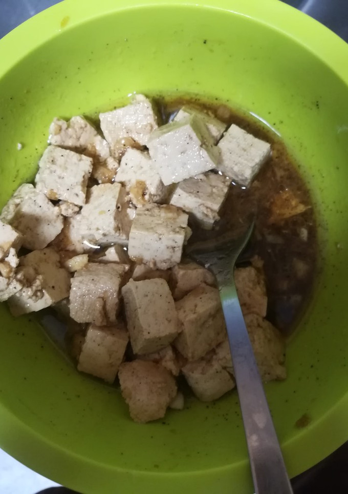 Una foto de Tofu macerado de aceite de oliva
