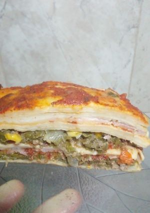 Una foto de Lasagnas de verdura, jamón y queso con salsa blanca y de tomate