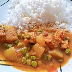 A picture of Rice with Aloo matar Vegetable.