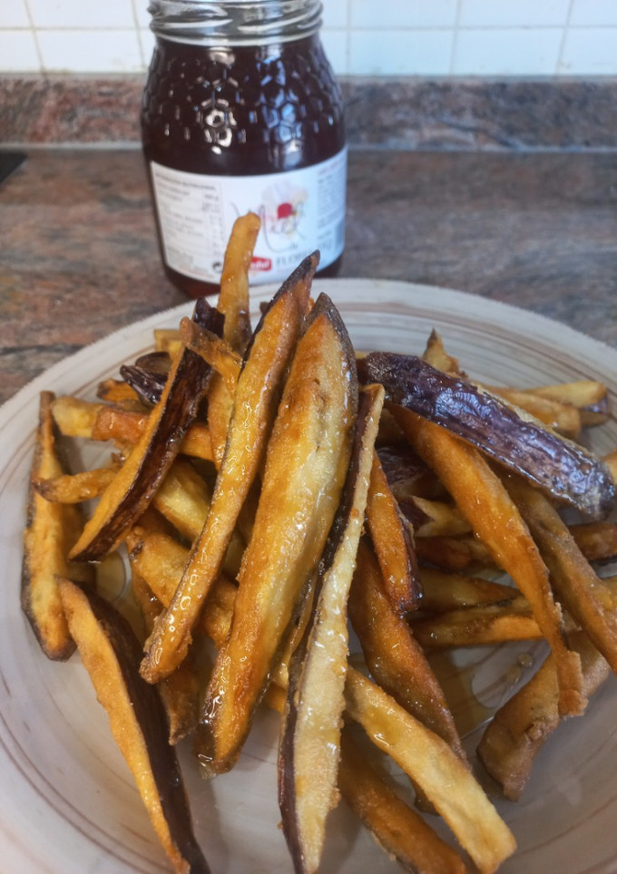 Una foto de Berenjenas fritas con miel 🍯