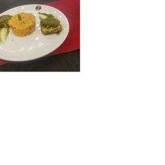 A picture of Tandoori Pesto paneer with tomato rice.