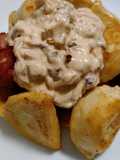 Pierogies and sausage with burnt onion cream