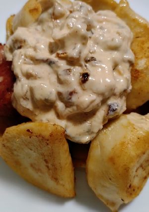 A picture of Pierogies and sausage with burnt onion cream.