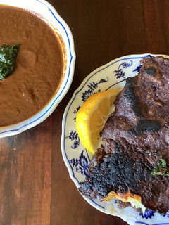 A picture of California Farm Quesa Birria Tacos and Consommé.