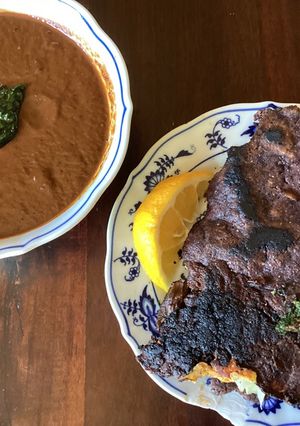 A picture of California Farm Quesa Birria Tacos and Consommé.