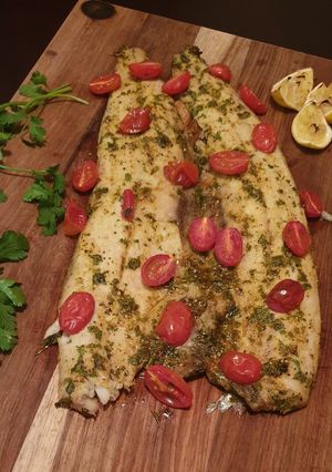 A picture of Masala snoek with roasted tomatoes.