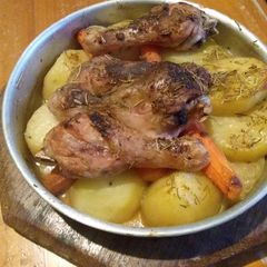 A picture of Patata fil form(Oven baked potatoes with Chicken drumsticks).