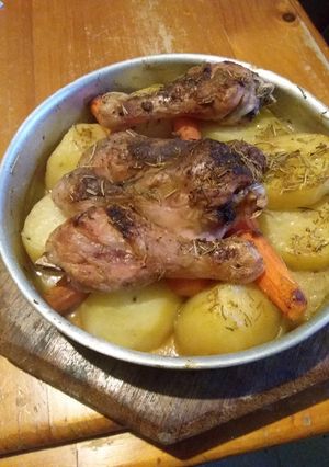 A picture of Patata fil form(Oven baked potatoes with Chicken drumsticks).