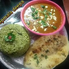 A picture of Spinach rice wth potato kofta curry and Naan.
