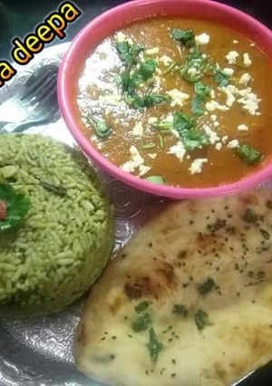 A picture of Spinach rice wth potato kofta curry and Naan.