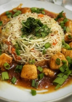 A picture of Smoky Chicken with fried rice.