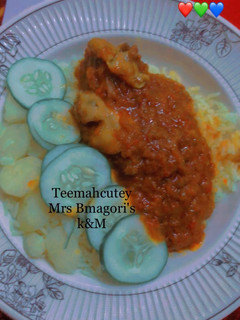 A picture of Curry rice with chicken stew.