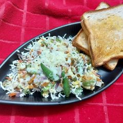 A picture of Scrambled Egg with Leftover Vegetables and Cheese.