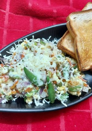 A picture of Scrambled Egg with Leftover Vegetables and Cheese.