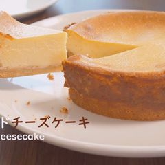 A picture of Cheesecake with Strawberry Sauce.