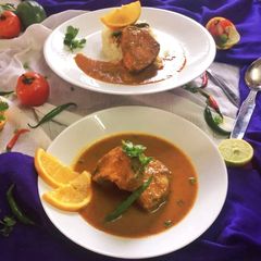 A picture of Fish curry in orange juice.