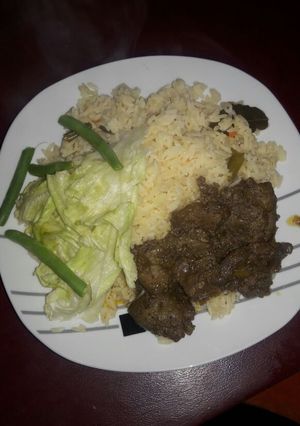 A picture of Ox liver with green salad.