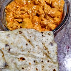 A picture of Chicken tikka boti masala with chapati.