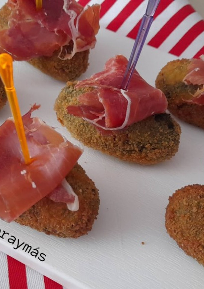 Una foto de Croquetas de espinacas y piñones