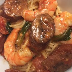 A picture of Cajun shrimp and smoked sausage pasta.