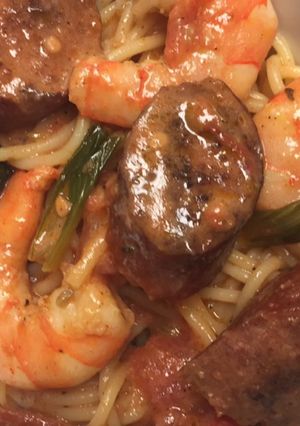 A picture of Cajun shrimp and smoked sausage pasta.