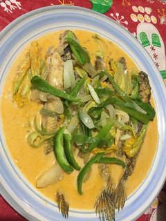A picture of Grey flathead Mullet with Pumpkin Flower in Thai Curry Sauce.