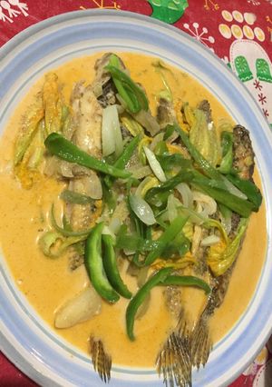 A picture of Grey flathead Mullet with Pumpkin Flower in Thai Curry Sauce.