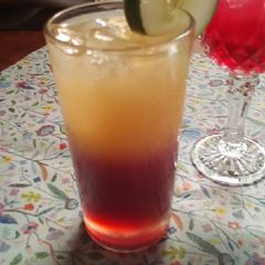 A picture of Hibiscus and orange mocktail.