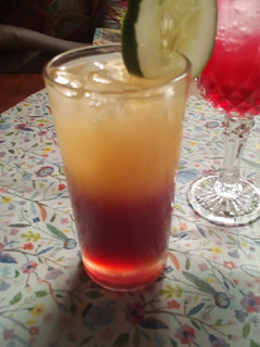 A picture of Hibiscus and orange mocktail.