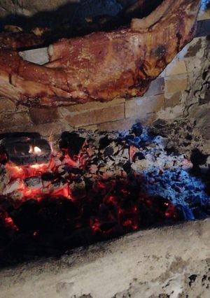 Una foto de Asado al palo