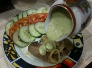 Una foto de filet de merluza con queso crema