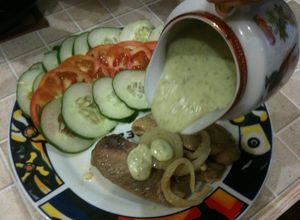 Una foto de Filetes de merluzas con salsa de queso crema y perejil