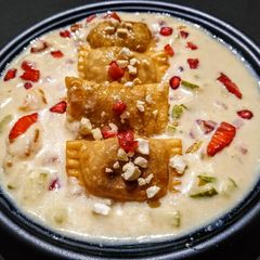 A picture of Fruity Gujiya in Rich Milk Sauce.