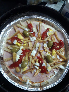 Una foto de Pizza súper completa